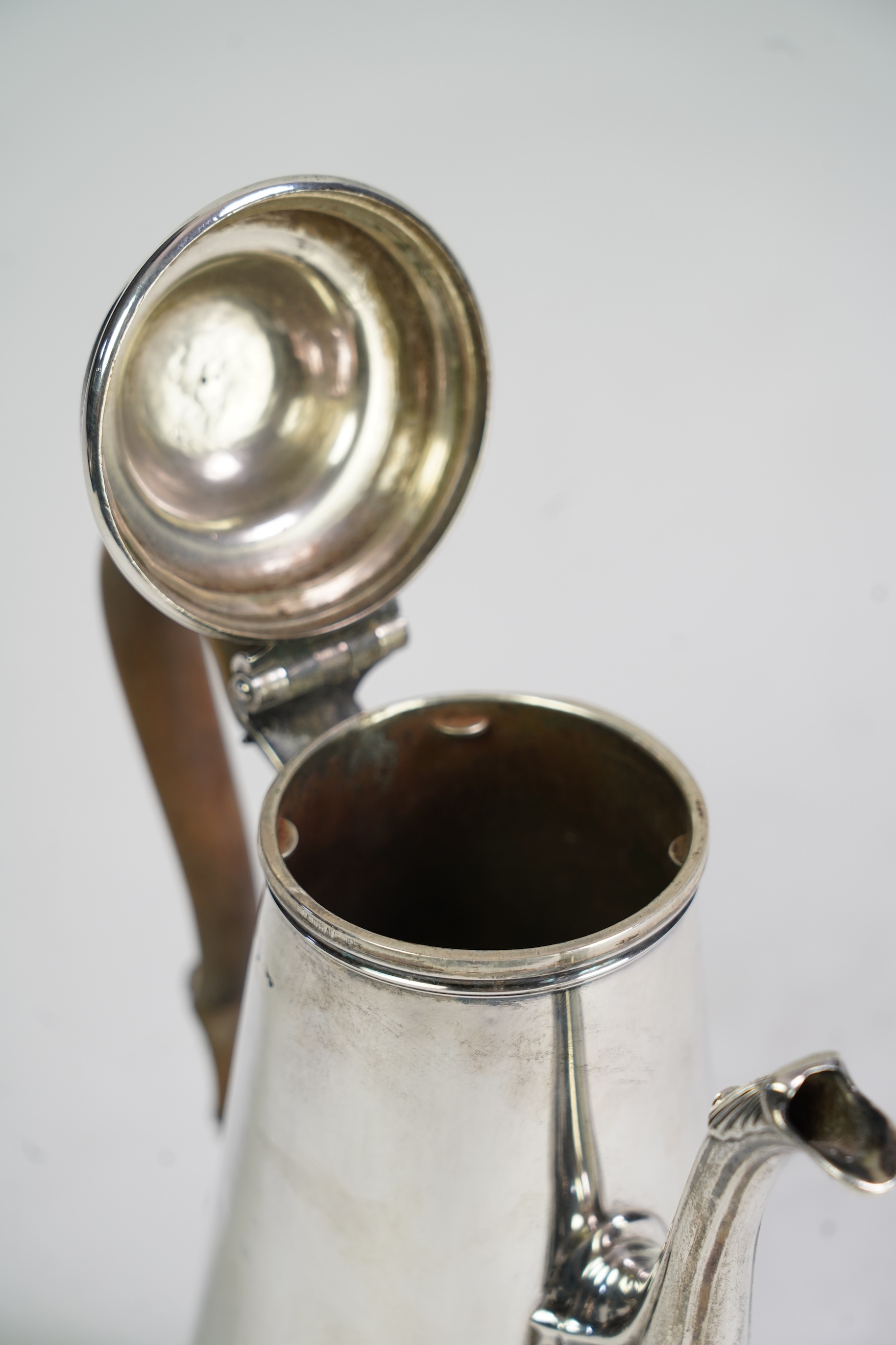 A mid 18th century silver coffee pot, marks very rubbed